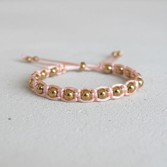 Made by Mothers pink satin cord bracelet with gold stainless steel beads, adjustable size.