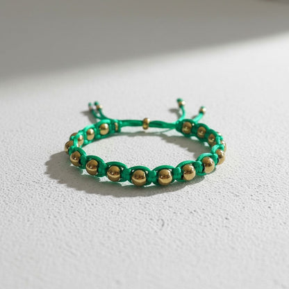 Made by Mothers green satin cord bracelet with gold stainless steel beads, adjustable size, waterproof.