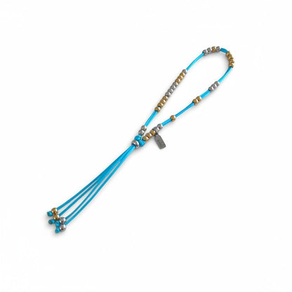 Made by Mothers Luna anklet with blue satin cord and alternating gold and silver stainless steel beads