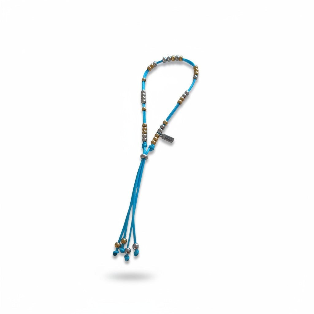 Made by Mothers The Luna Anklet with blue satin cord and hypoallergenic stainless steel beads, waterproof design.
