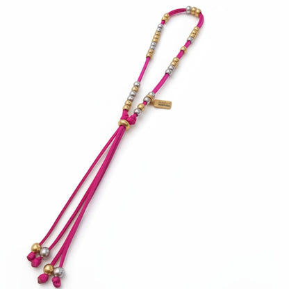 Made by Mothers The Luna Anklet with vibrant pink satin cord and hypoallergenic gold and silver stainless steel beads