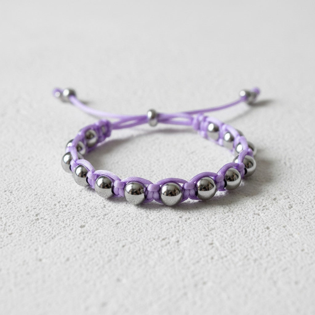 Made by Mothers Luna Aura bracelet with silver stainless steel beads and a lavender satin cord. Adjustable and waterproof.