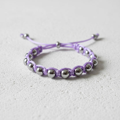 Made by Mothers Luna Aura bracelet with silver stainless steel beads and a lavender satin cord. Adjustable and waterproof.