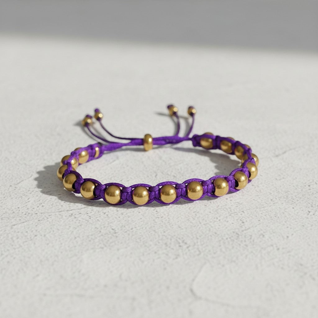 Made by Mothers Luna Aura adjustable bracelet with purple satin cord and gold stainless steel beads. Waterproof.