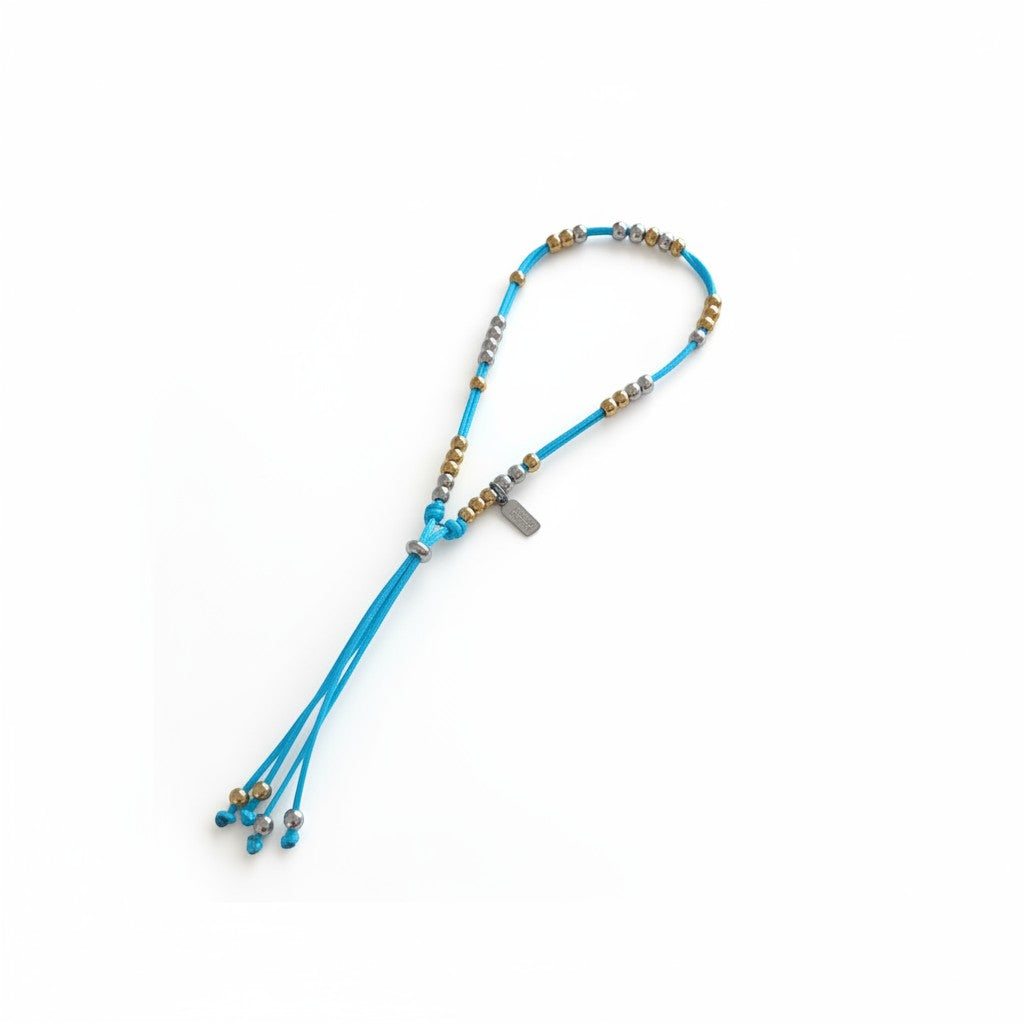 Made by Mothers Luna waterproof anklet with blue satin cord and hypoallergenic stainless steel beads