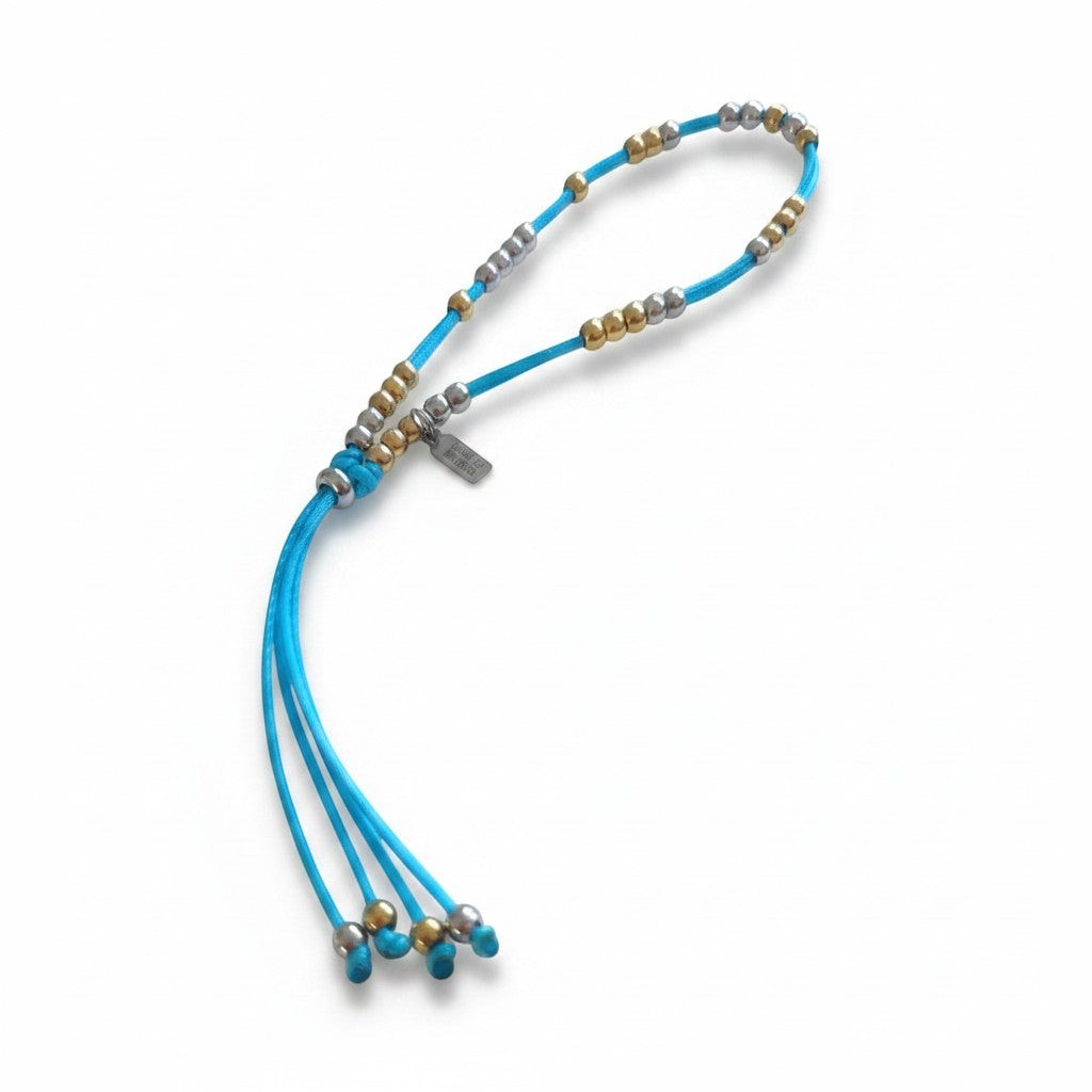 Made by Mothers Luna waterproof anklet with blue satin cord and mixed gold and silver stainless steel beads.