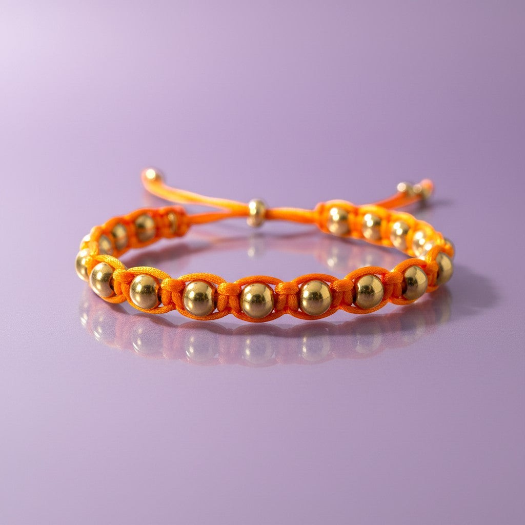 Made by Mothers orange satin cord bracelet with gold stainless steel beads, adjustable size, waterproof.