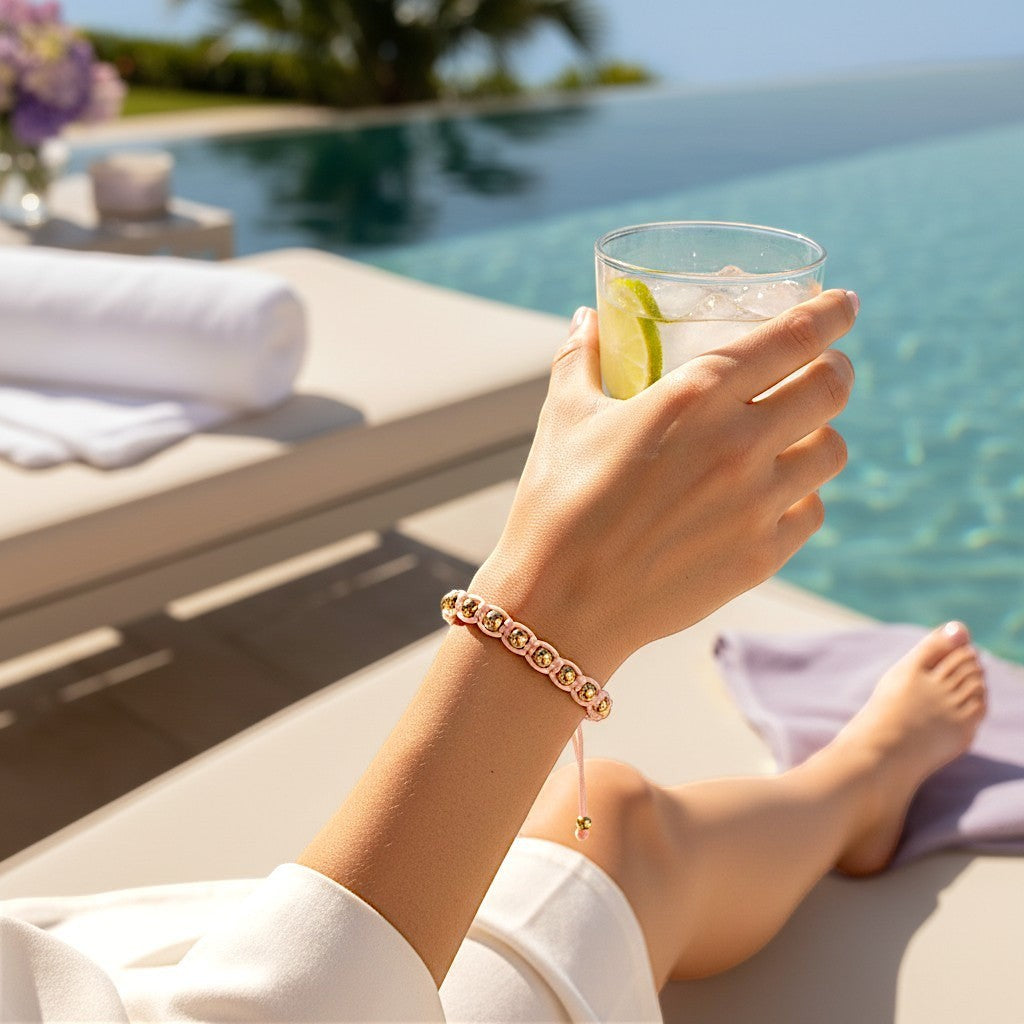 Made by Mothers pink satin cord bracelet with gold-tone beads, adjustable size, waterproof.