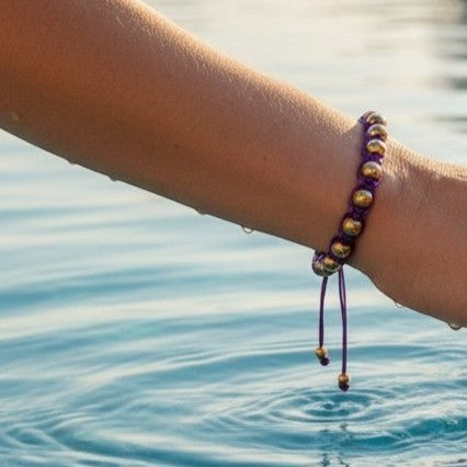Made by Mothers purple satin cord bracelet with gold stainless steel beads, adjustable.