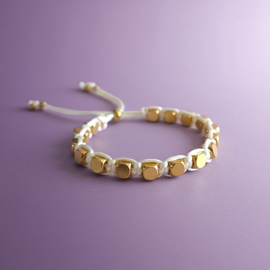 Made by Mothers Stella Aura adjustable bracelet with gold stainless steel beads on a white silky satin cord